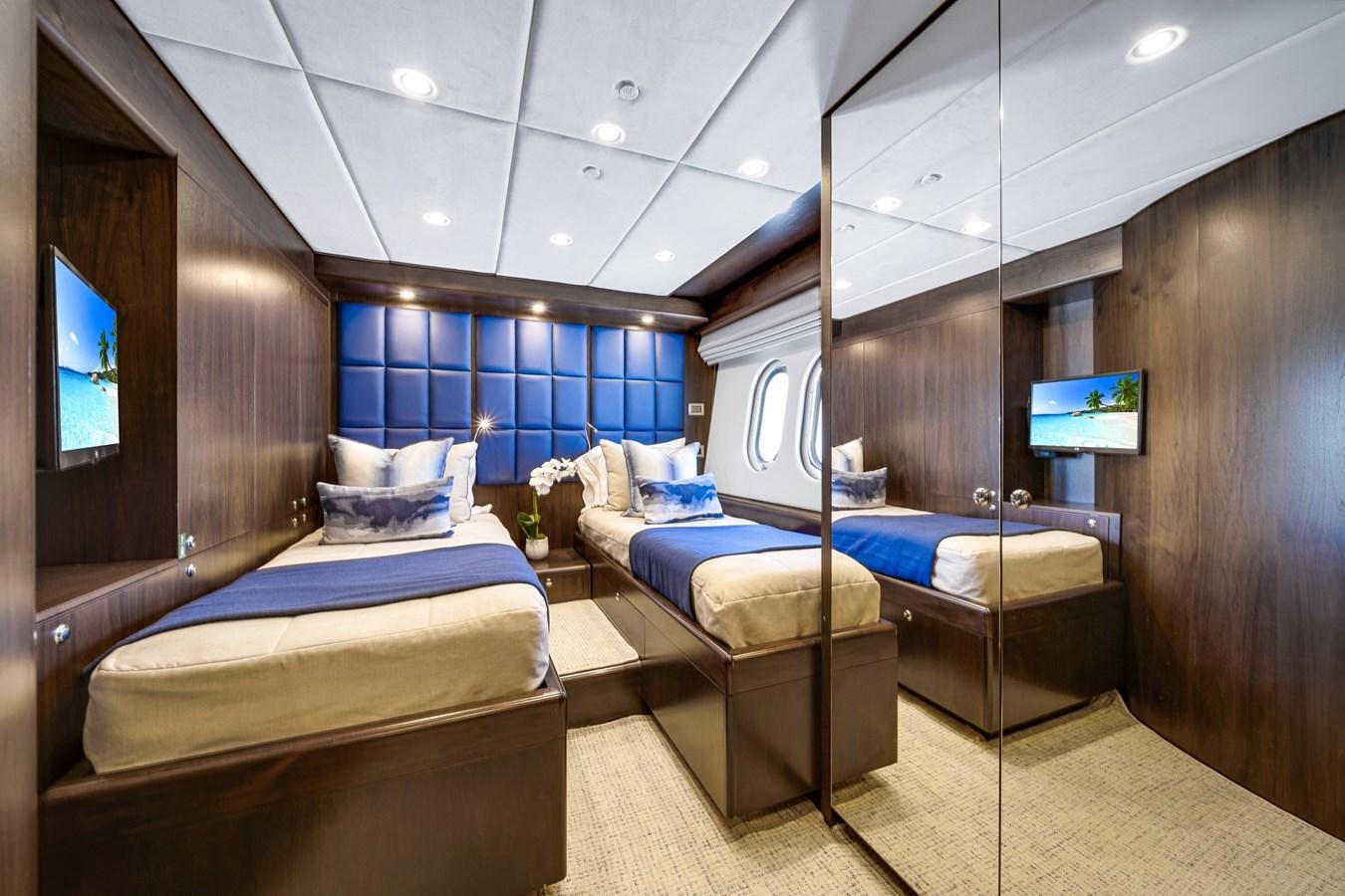 a room with a bed and a tv aboard FAMILYBILT Yacht for Sale
