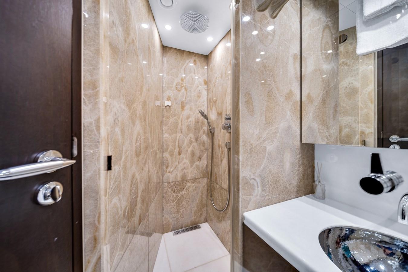 a bathroom with a sink and a shower aboard FAMILYBILT Yacht for Sale