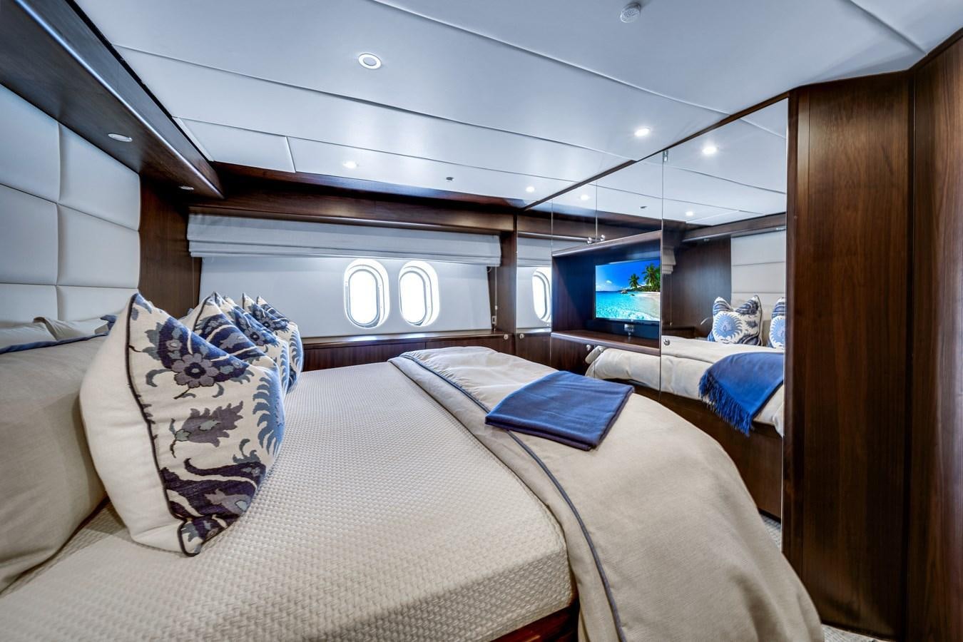 a room with a bed and a television aboard FAMILYBILT Yacht for Sale