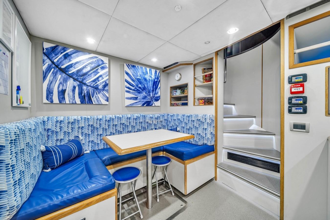 a room with a couch and a table aboard FAMILYBILT Yacht for Sale