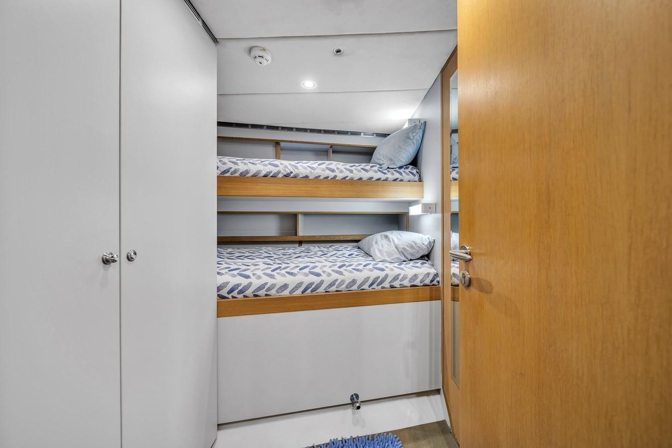 a closet with a couple of beds aboard FAMILYBILT Yacht for Sale