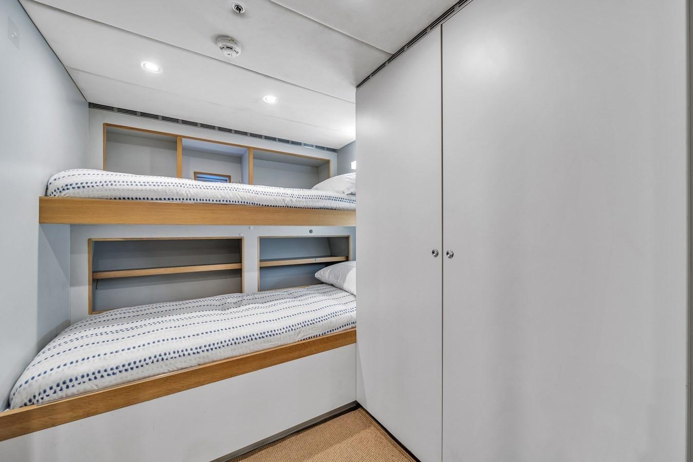 bunk beds in a room aboard FAMILYBILT Yacht for Sale