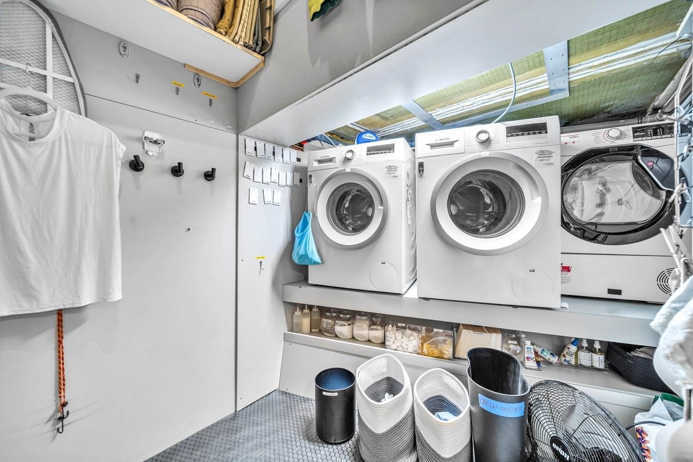 a room with white machines aboard FAMILYBILT Yacht for Sale