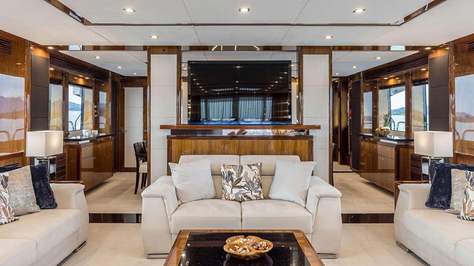 a living room with a fireplace aboard KATARIINA I Yacht for Sale