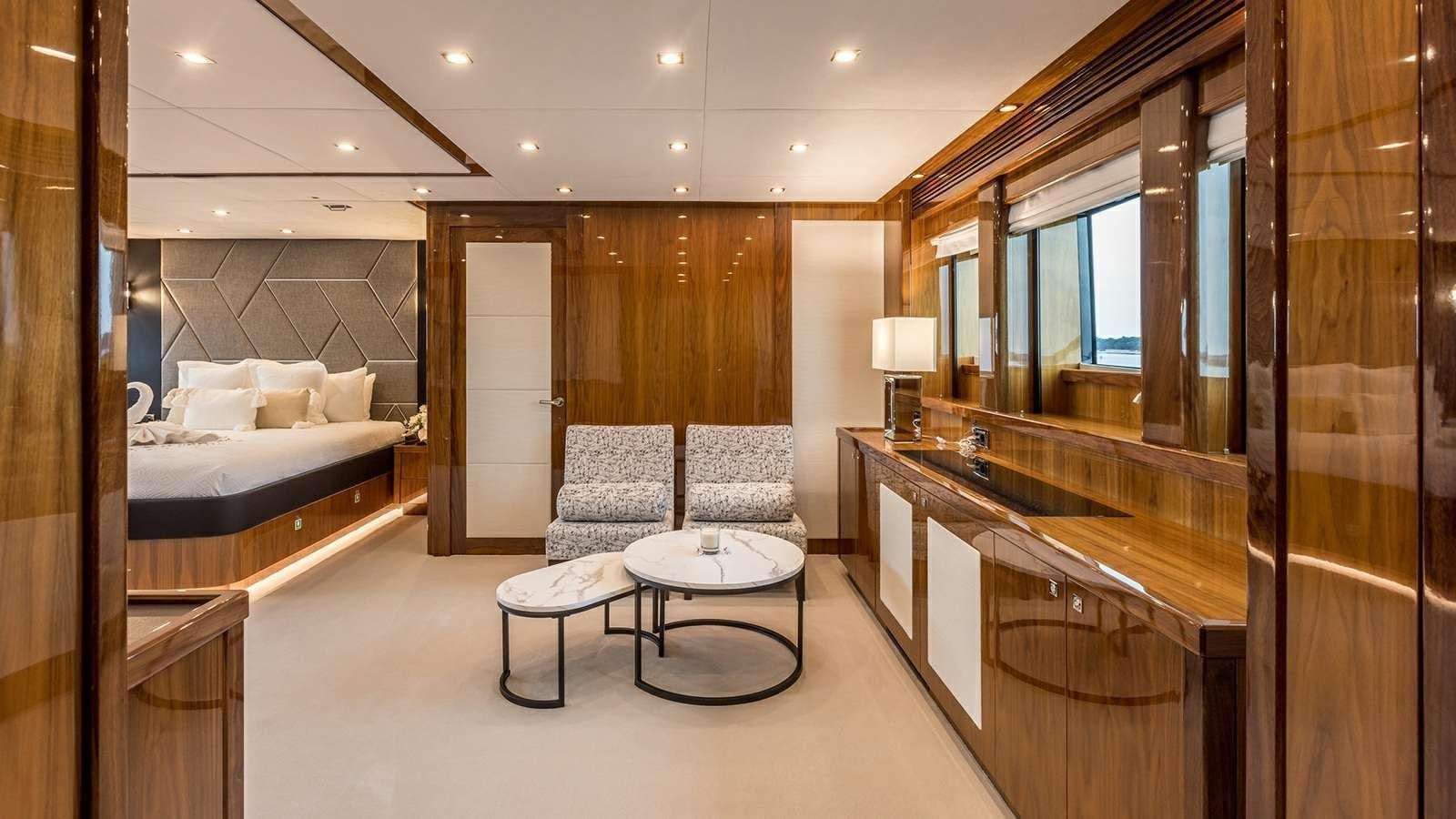 a room with a bed and a table aboard KATARIINA I Yacht for Sale
