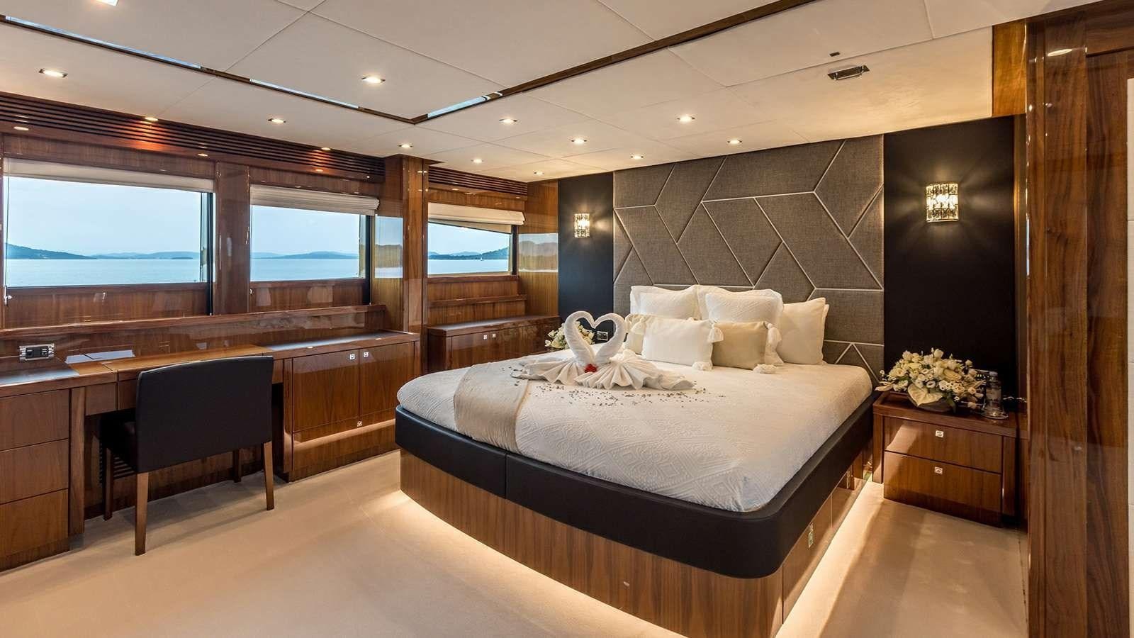 a large bedroom with a large bed aboard KATARIINA I Yacht for Sale