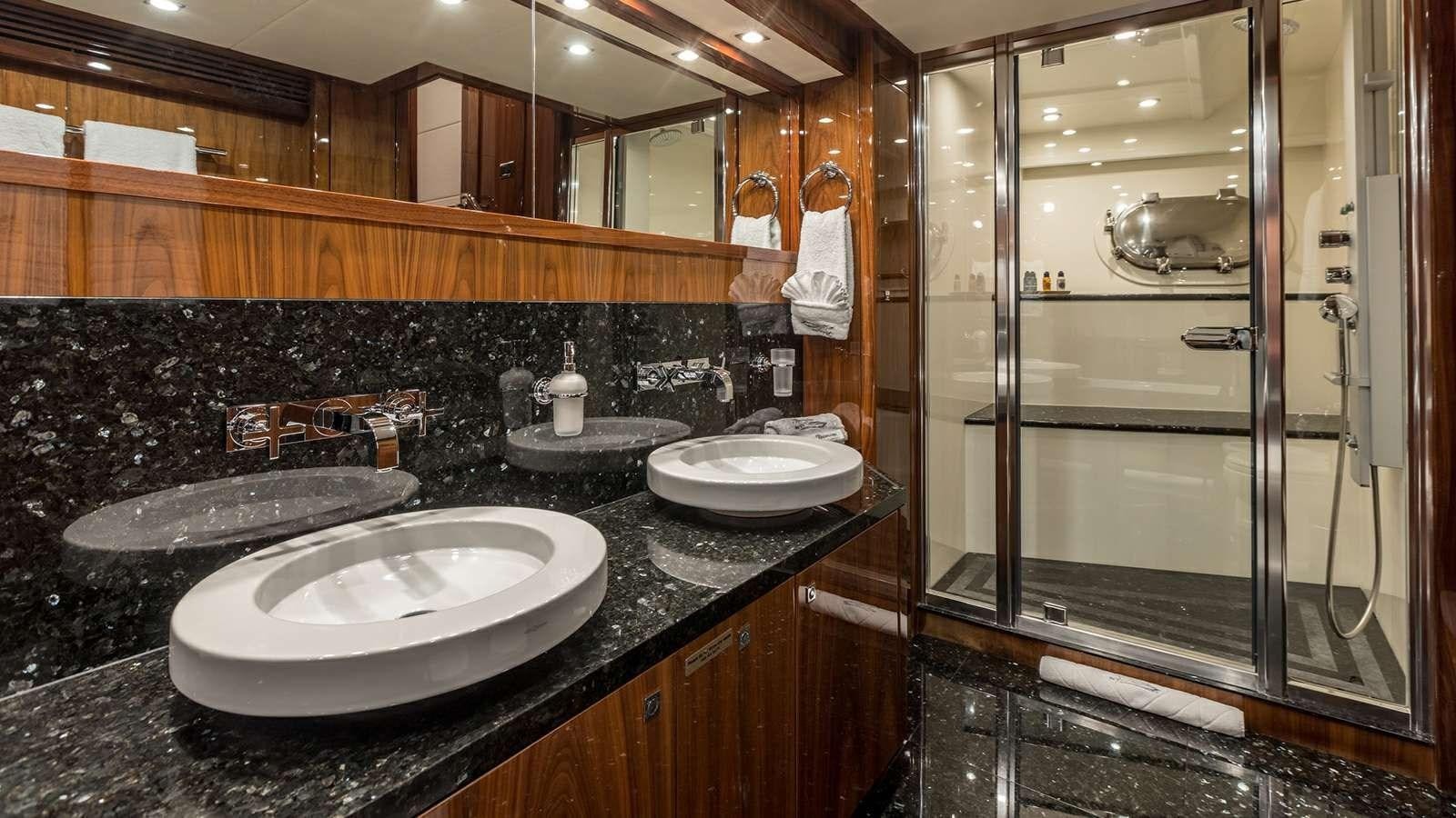 a bathroom with sinks and mirrors aboard KATARIINA I Yacht for Sale
