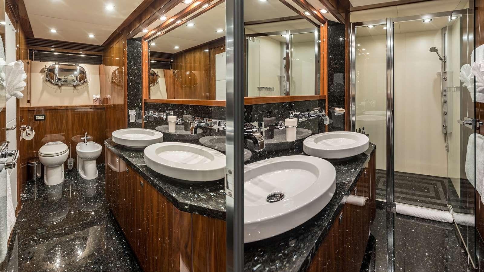 a bathroom with a large mirror aboard KATARIINA I Yacht for Sale