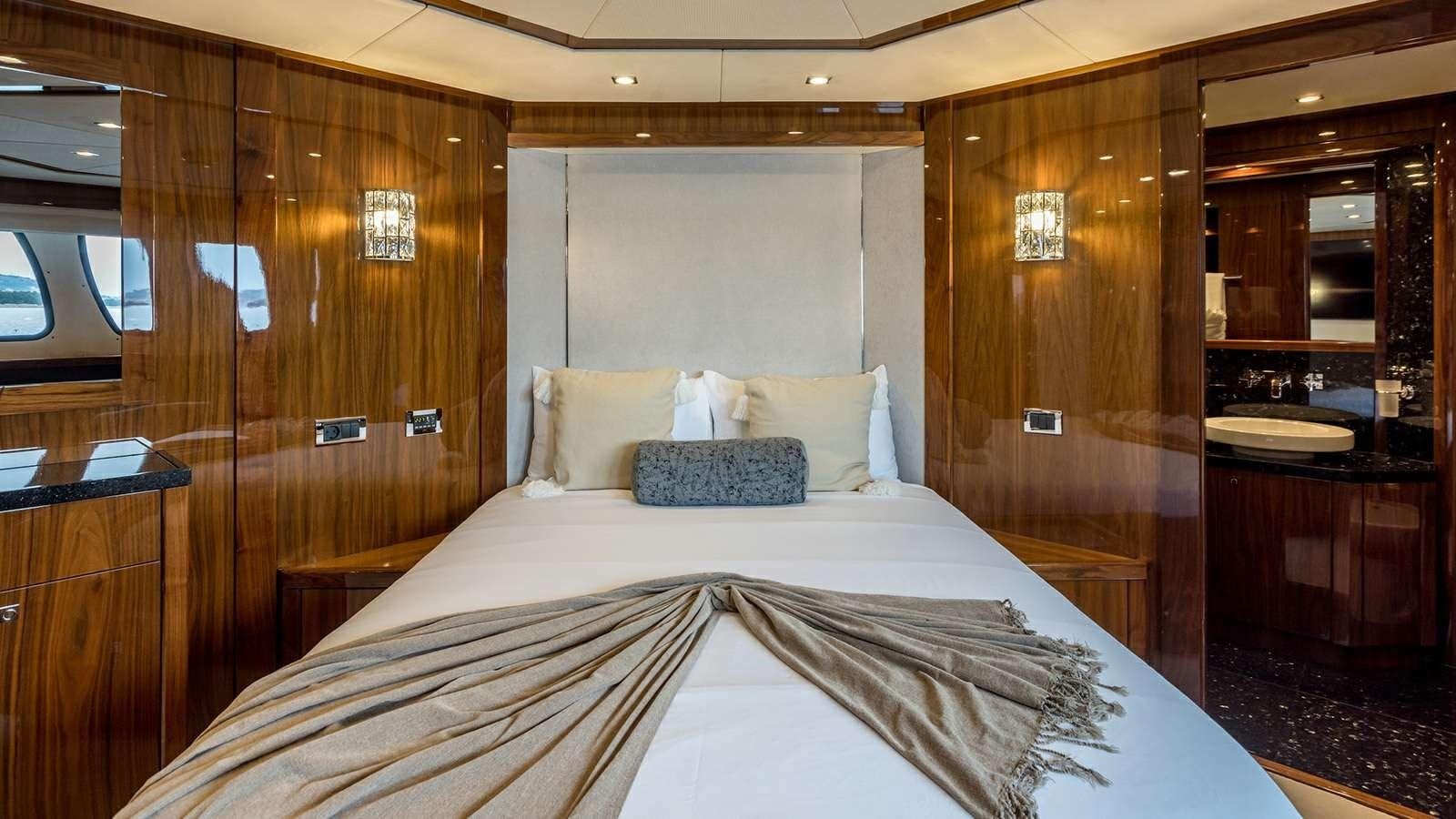a bed with white sheets aboard KATARIINA I Yacht for Sale