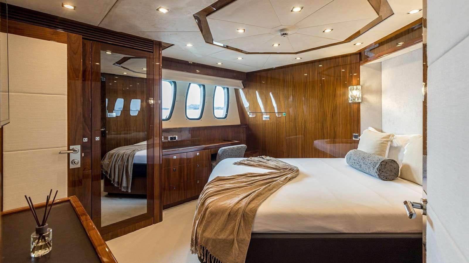 a room with a bed and a glass door aboard KATARIINA I Yacht for Sale