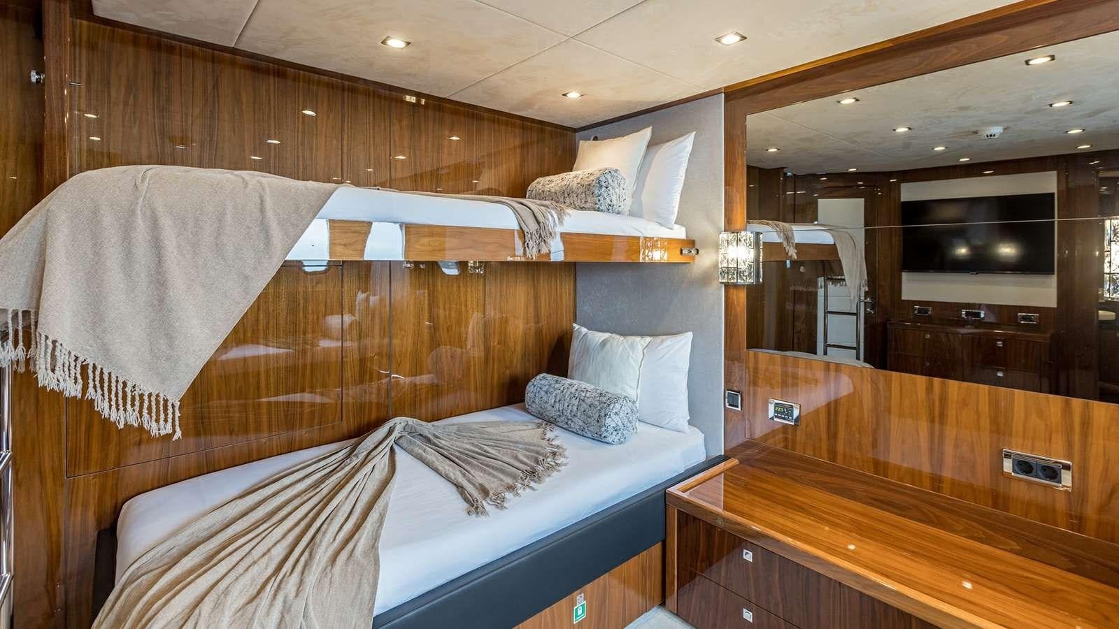 a room with a bed and a desk aboard KATARIINA I Yacht for Sale