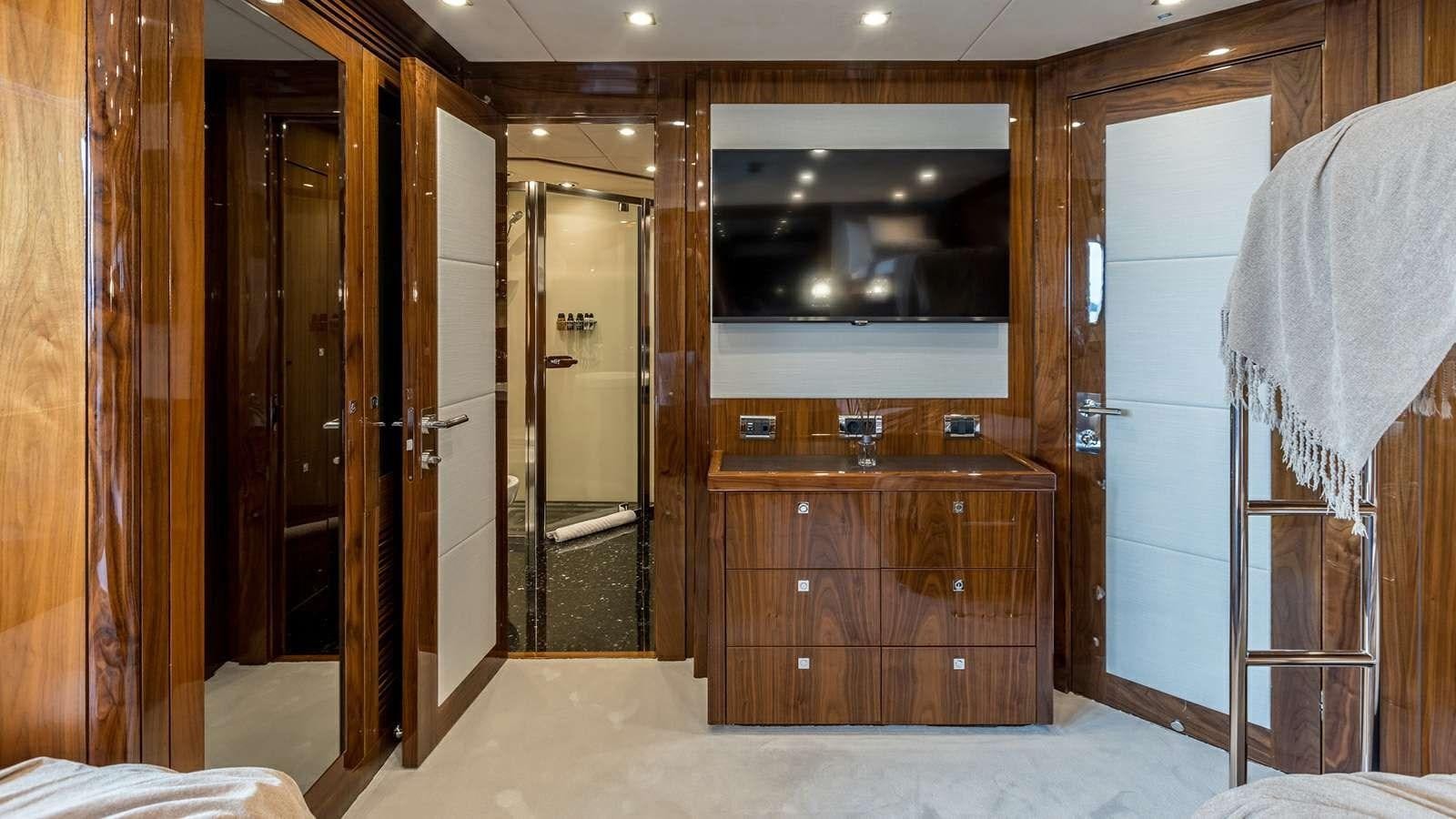 a room with a tv and a closet aboard KATARIINA I Yacht for Sale