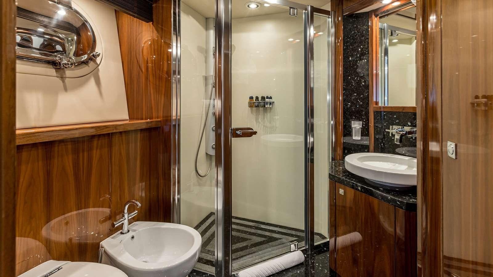 a bathroom with a glass shower aboard KATARIINA I Yacht for Sale