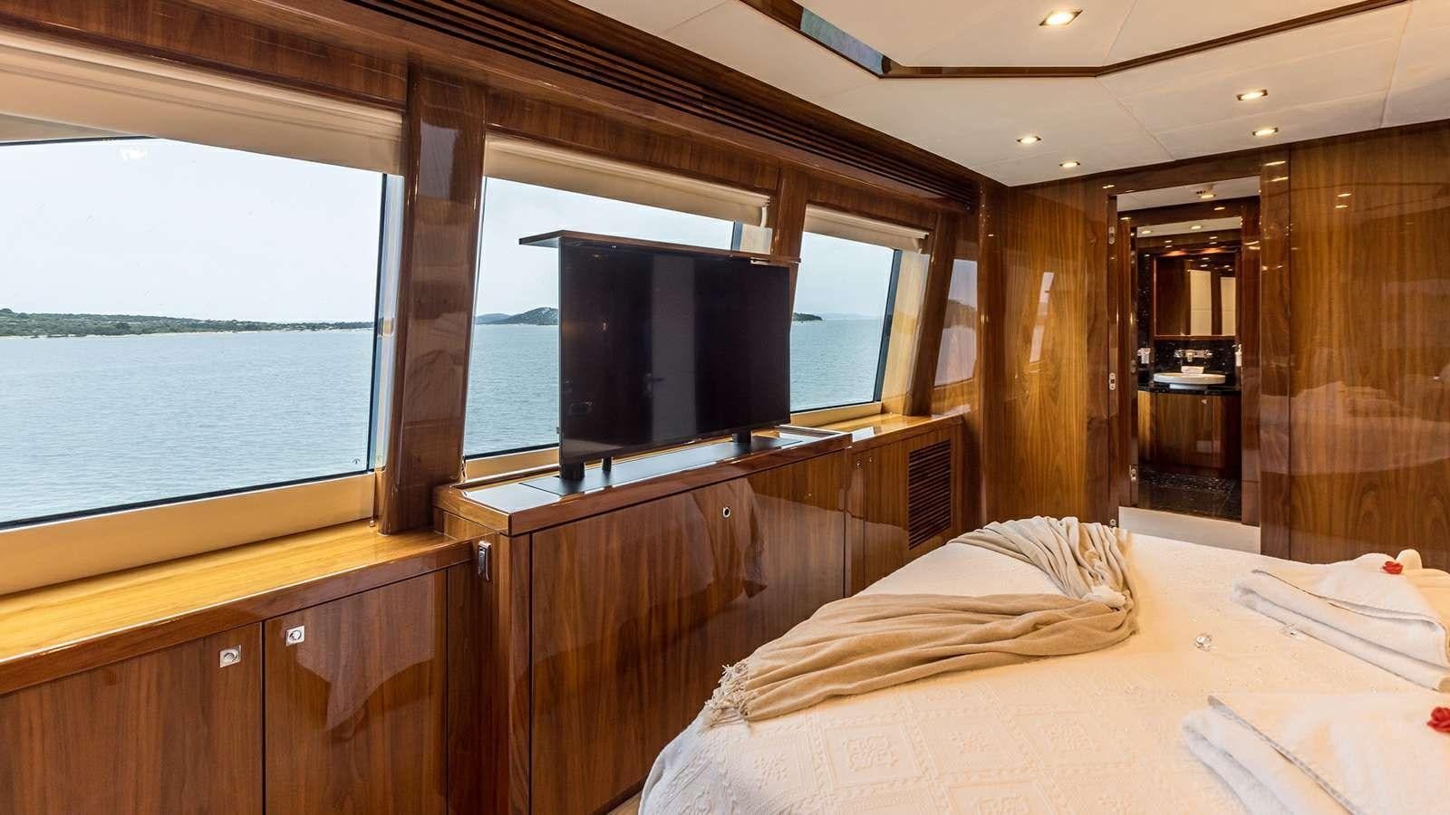 a room with a bed and a tv aboard KATARIINA I Yacht for Sale