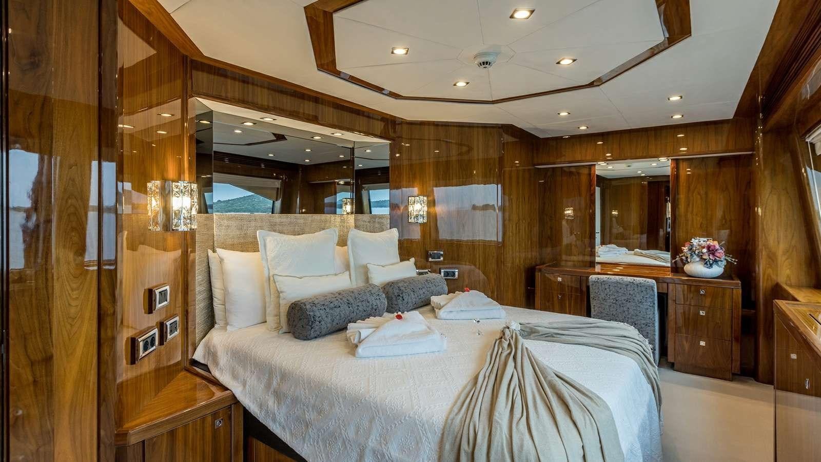 a room with a bed and a mirror aboard KATARIINA I Yacht for Sale