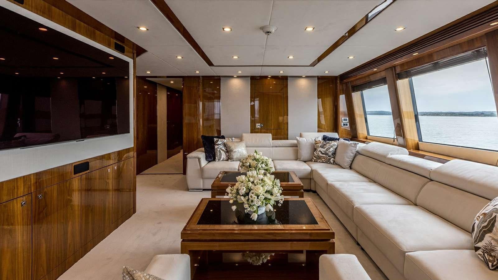 a living room with a couch and a coffee table aboard KATARIINA I Yacht for Sale
