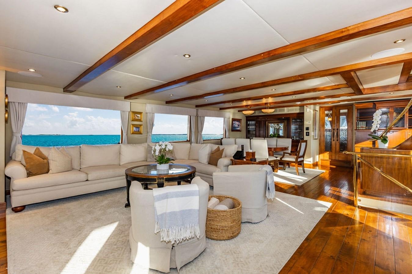 a living room with a large window aboard EMPIRE SEA Yacht for Sale