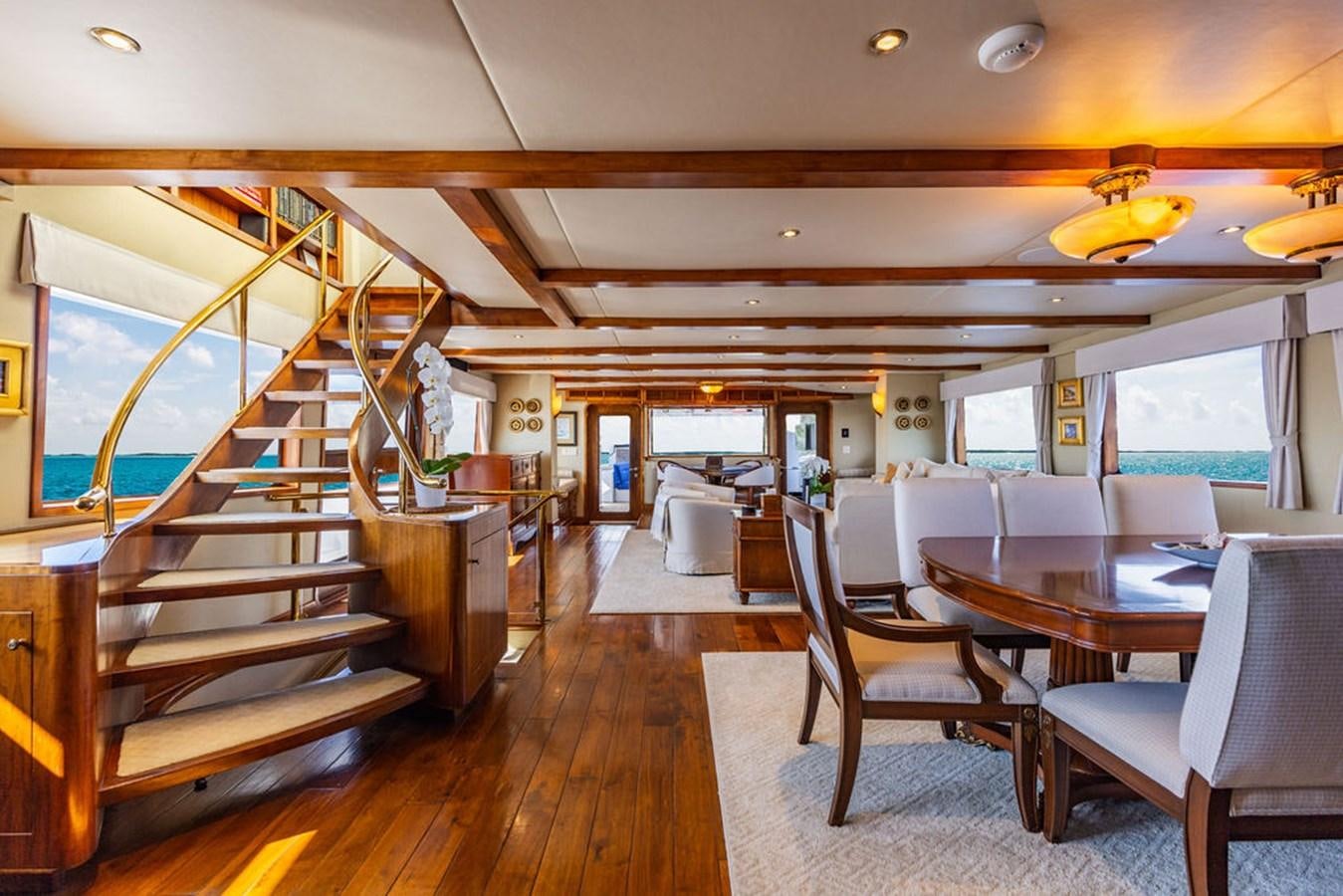 a room with a table and chairs aboard EMPIRE SEA Yacht for Sale