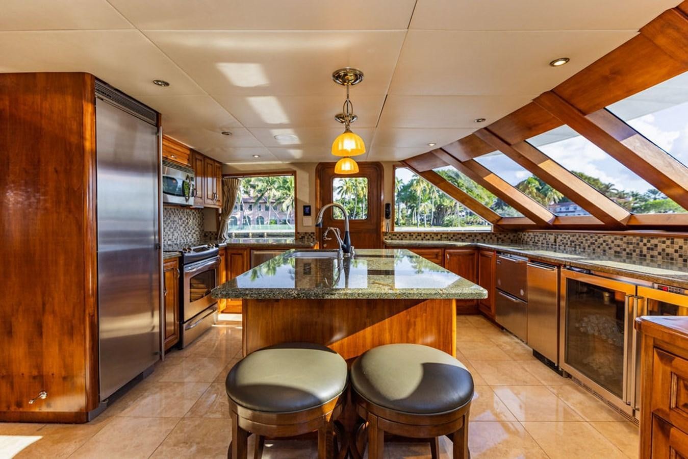 a kitchen with a large island aboard EMPIRE SEA Yacht for Sale
