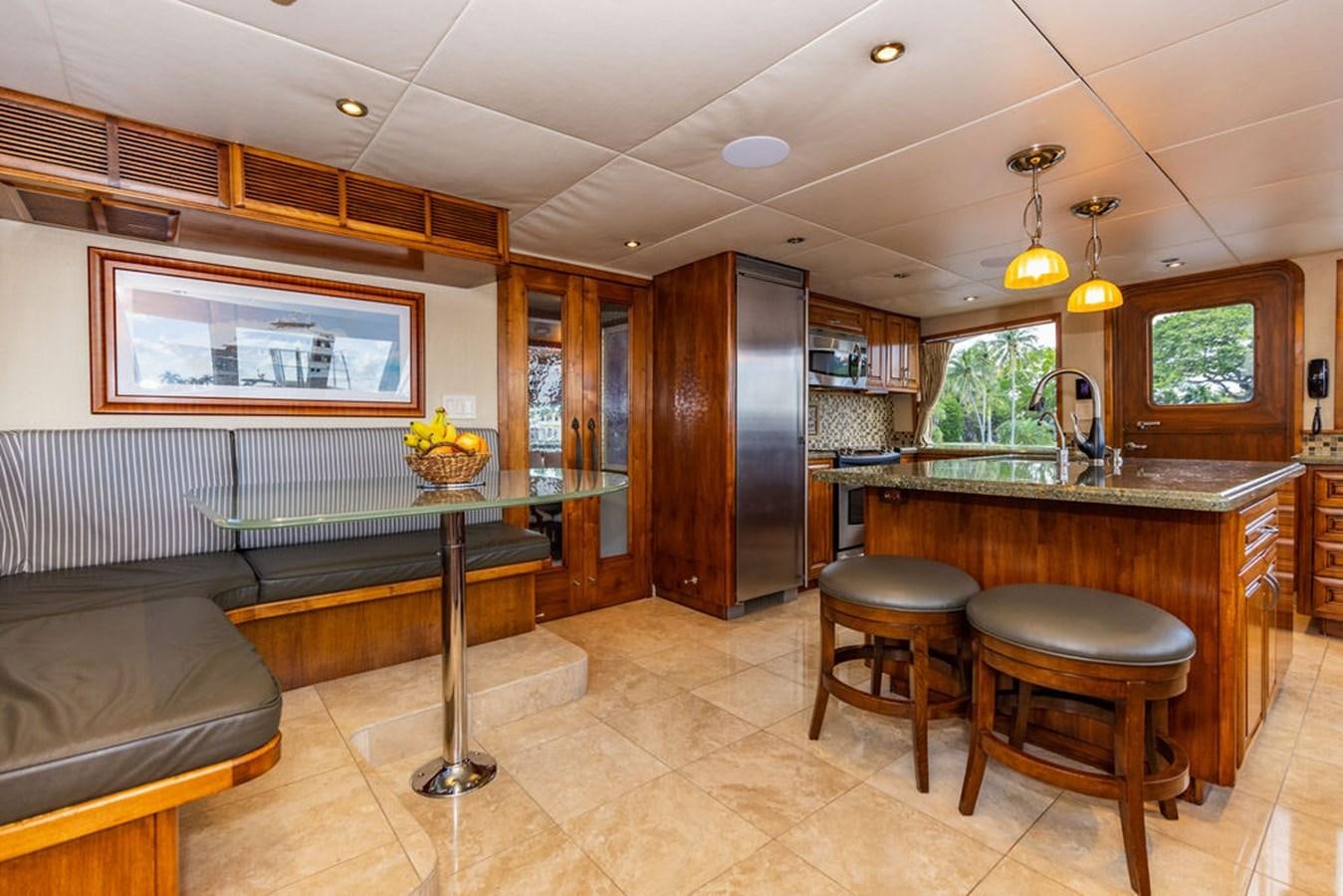 a kitchen with a bar and bar aboard EMPIRE SEA Yacht for Sale