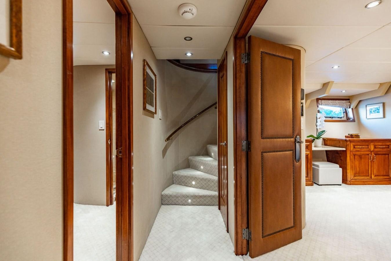 a room with a staircase and a door aboard EMPIRE SEA Yacht for Sale