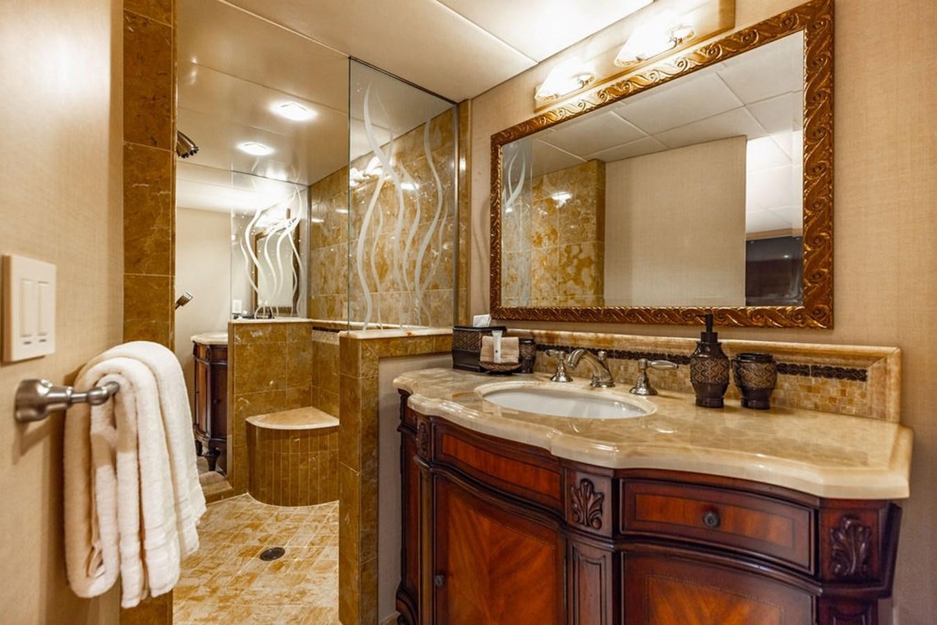 a bathroom with a large mirror aboard EMPIRE SEA Yacht for Sale