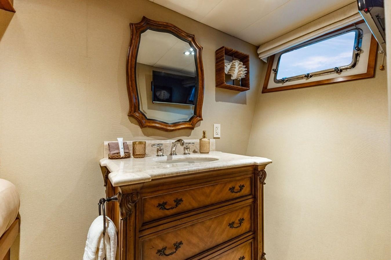 a bathroom with a large mirror aboard EMPIRE SEA Yacht for Sale