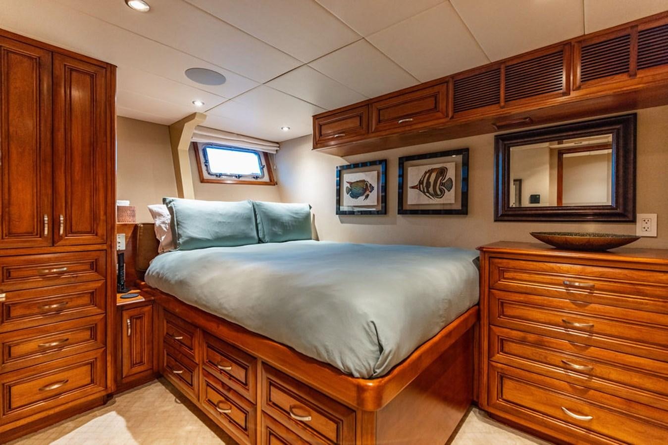 a bed in a room aboard EMPIRE SEA Yacht for Sale