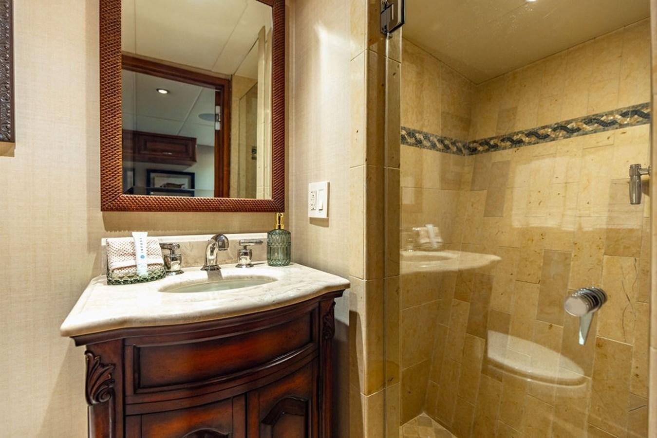 a bathroom with a sink and a mirror aboard EMPIRE SEA Yacht for Sale