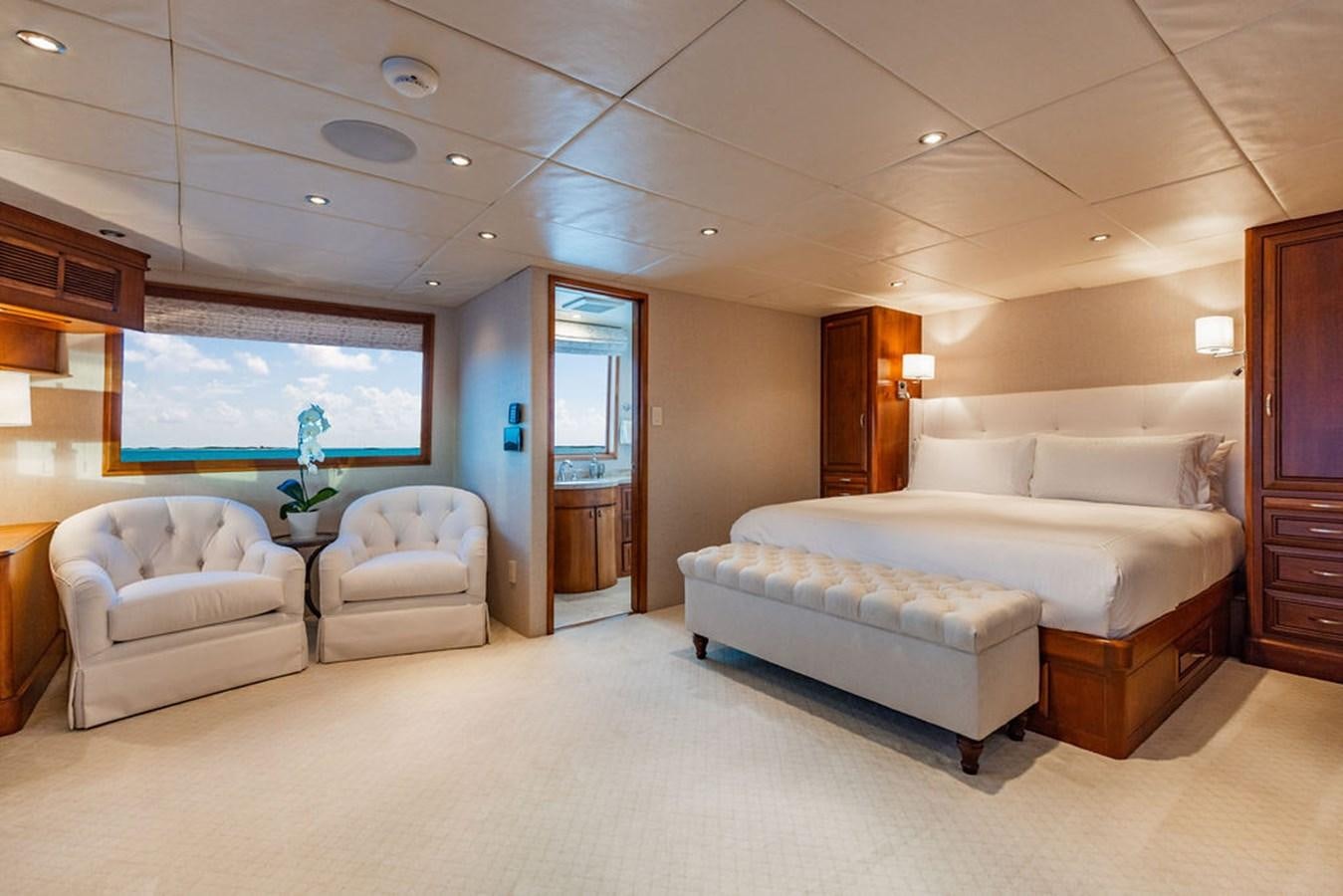 a room with a bed and a table aboard EMPIRE SEA Yacht for Sale