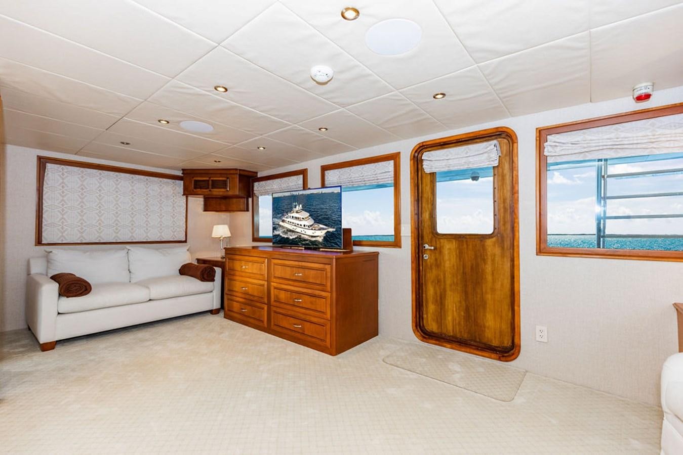 a room with a bed and a couch aboard EMPIRE SEA Yacht for Sale