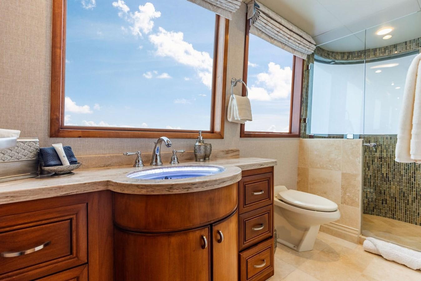 a bathroom with a sink and a window aboard EMPIRE SEA Yacht for Sale