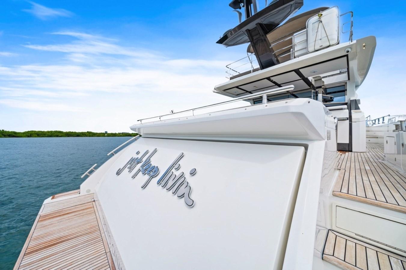 a boat docked at a pier aboard JUST KEEP LIVIN Yacht for Sale