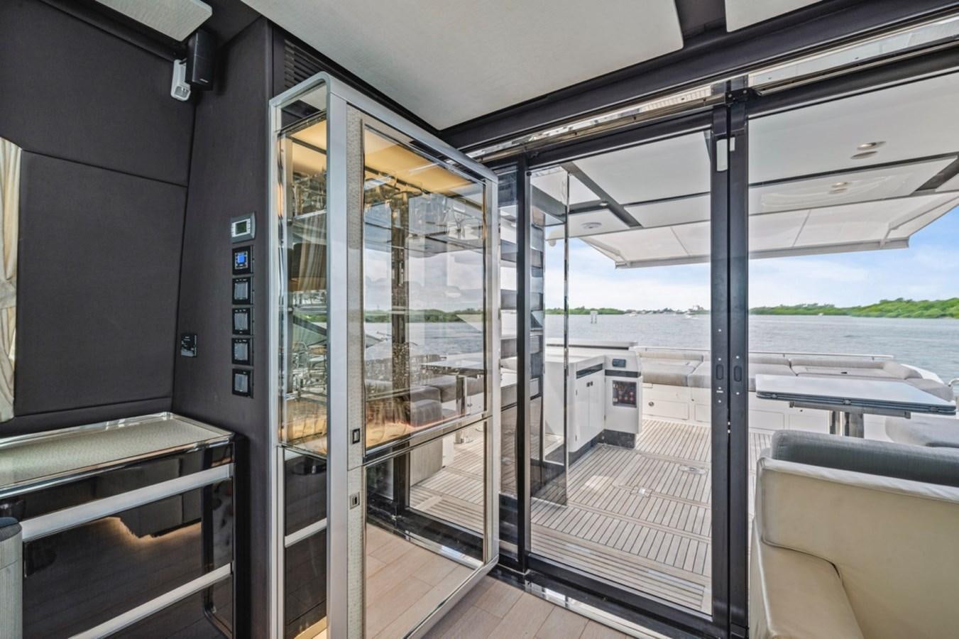 a train car with glass doors aboard JUST KEEP LIVIN Yacht for Sale