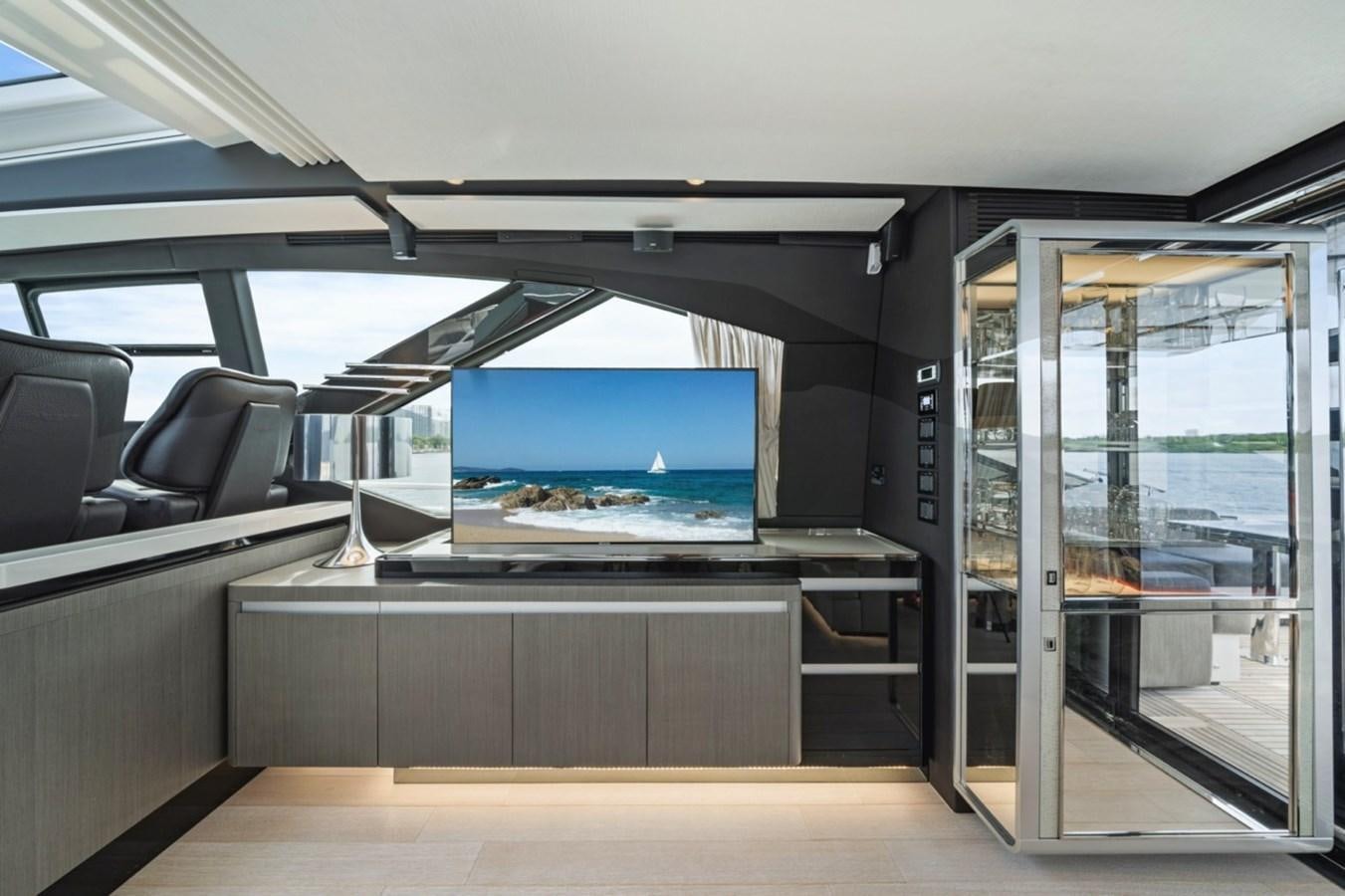 a room with a large glass window aboard JUST KEEP LIVIN Yacht for Sale