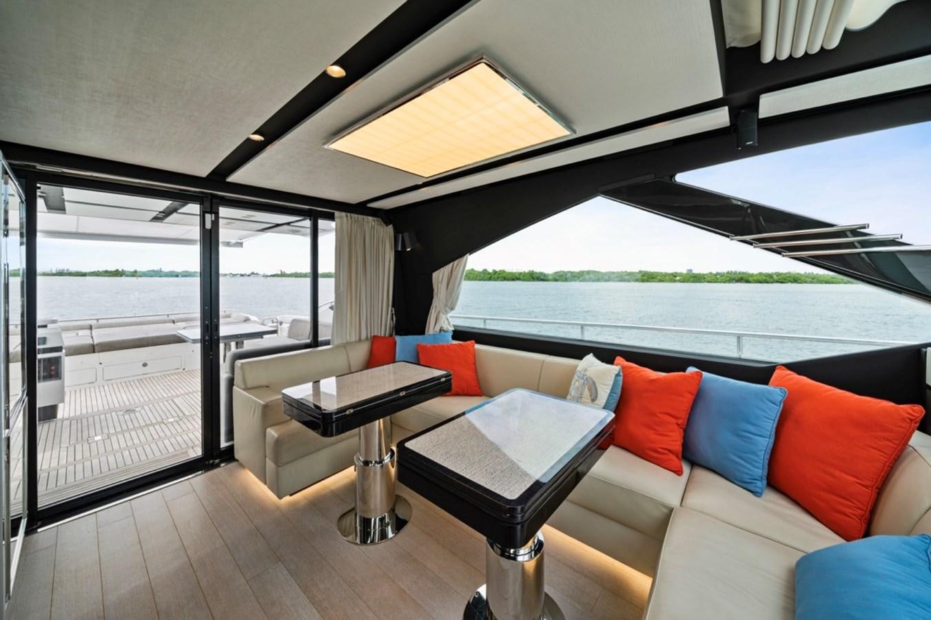 a living room with a large patio aboard JUST KEEP LIVIN Yacht for Sale