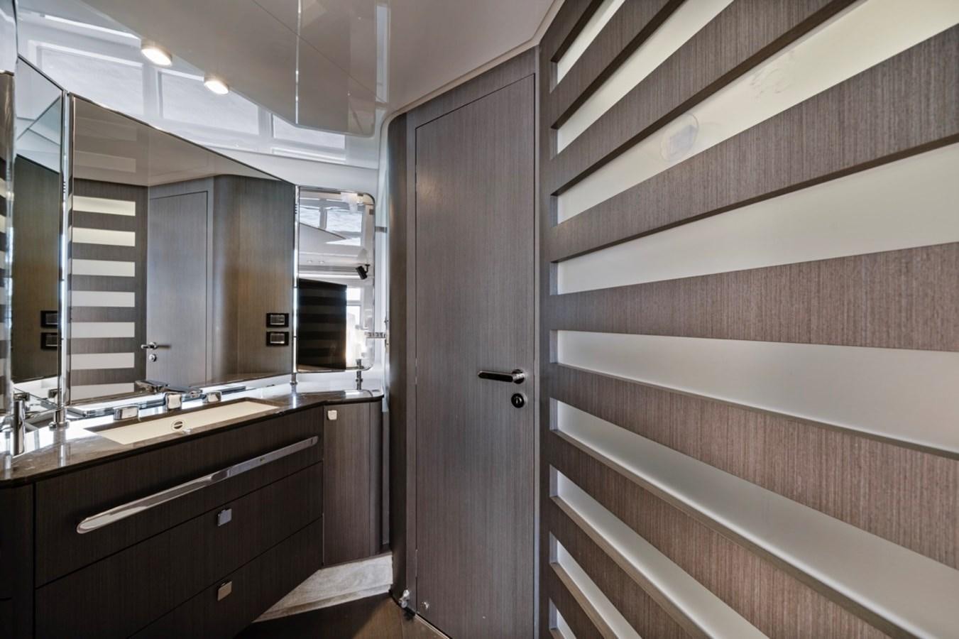 a bathroom with a wood door aboard JUST KEEP LIVIN Yacht for Sale