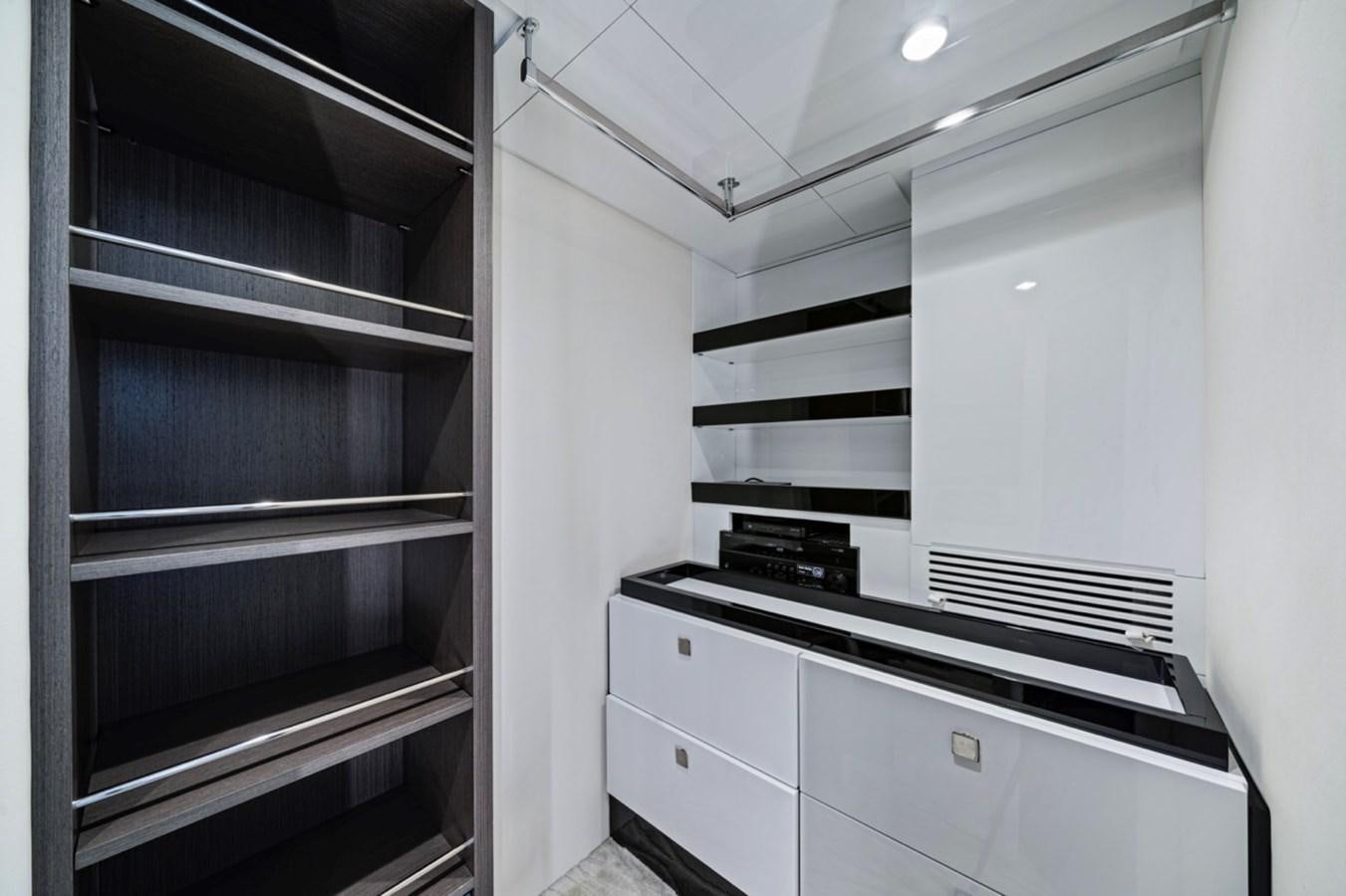 a room with a shelf and a shelf with objects on it aboard JUST KEEP LIVIN Yacht for Sale