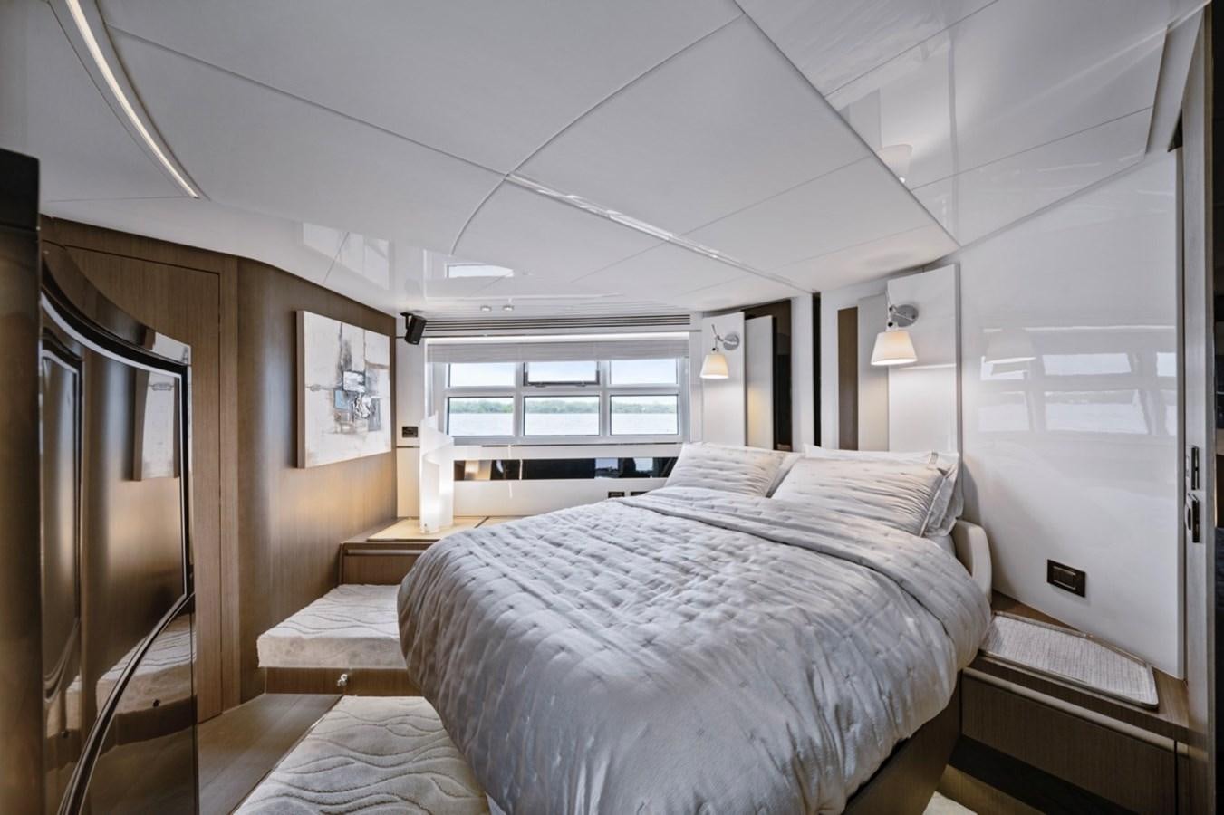 a bedroom with a bed and a closet aboard JUST KEEP LIVIN Yacht for Sale