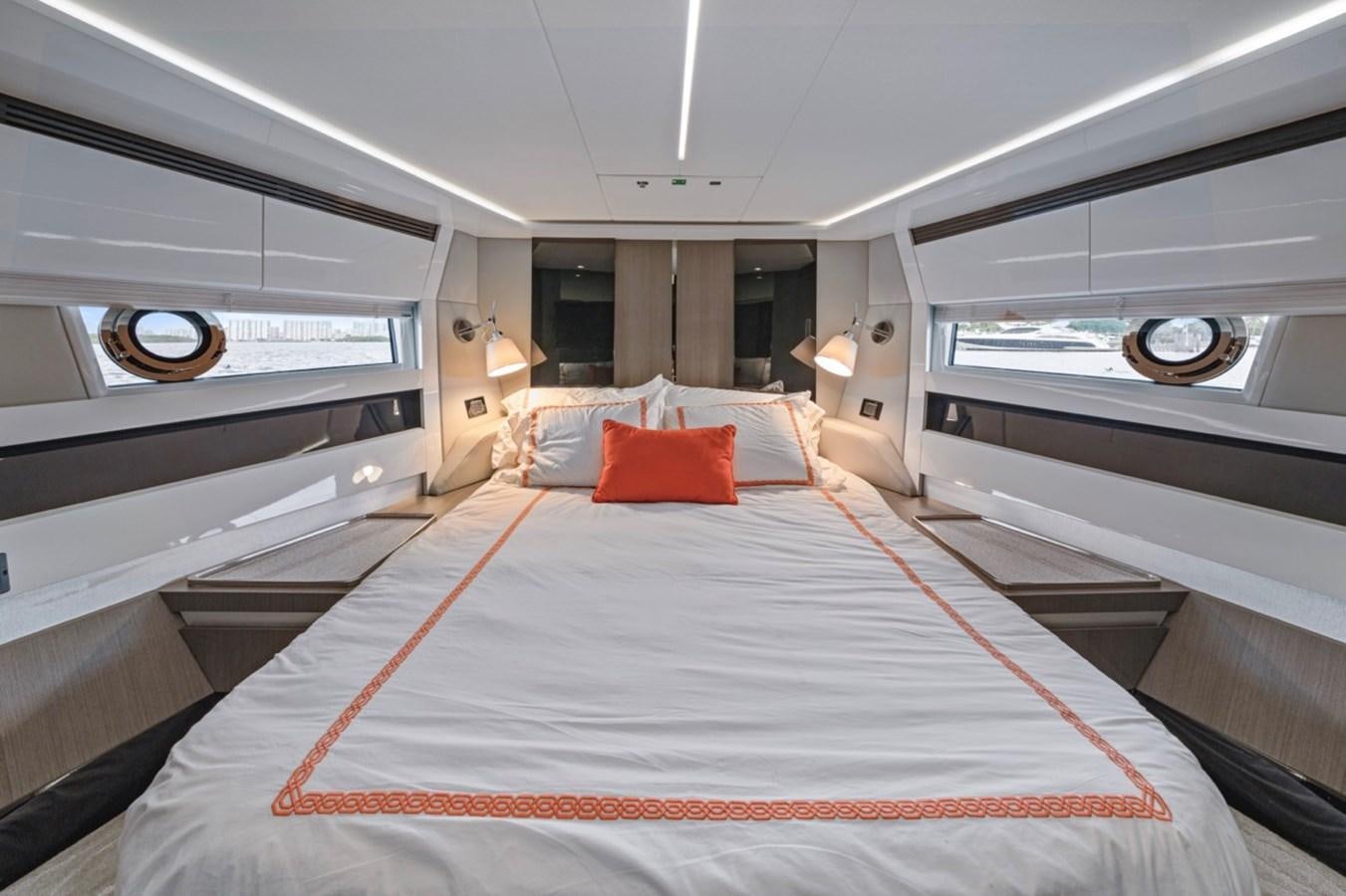 a room with a bed and a large mirror aboard JUST KEEP LIVIN Yacht for Sale