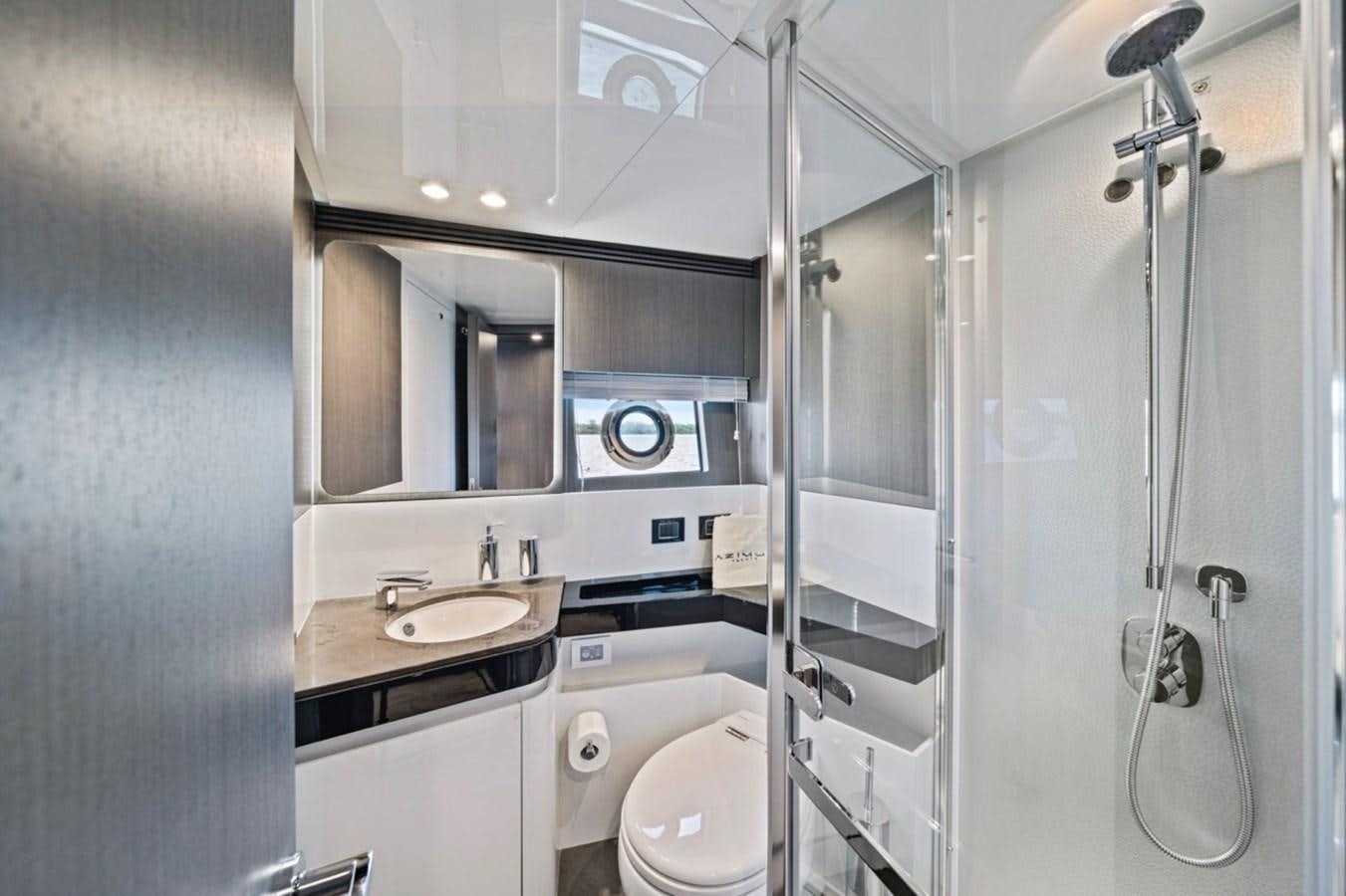 a bathroom with a glass shower aboard JUST KEEP LIVIN Yacht for Sale