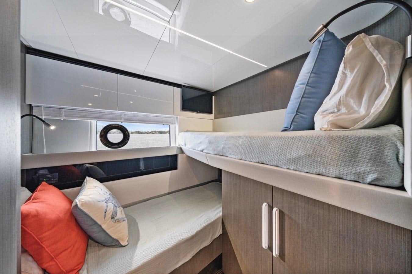 a room with a bed and a pillow aboard JUST KEEP LIVIN Yacht for Sale