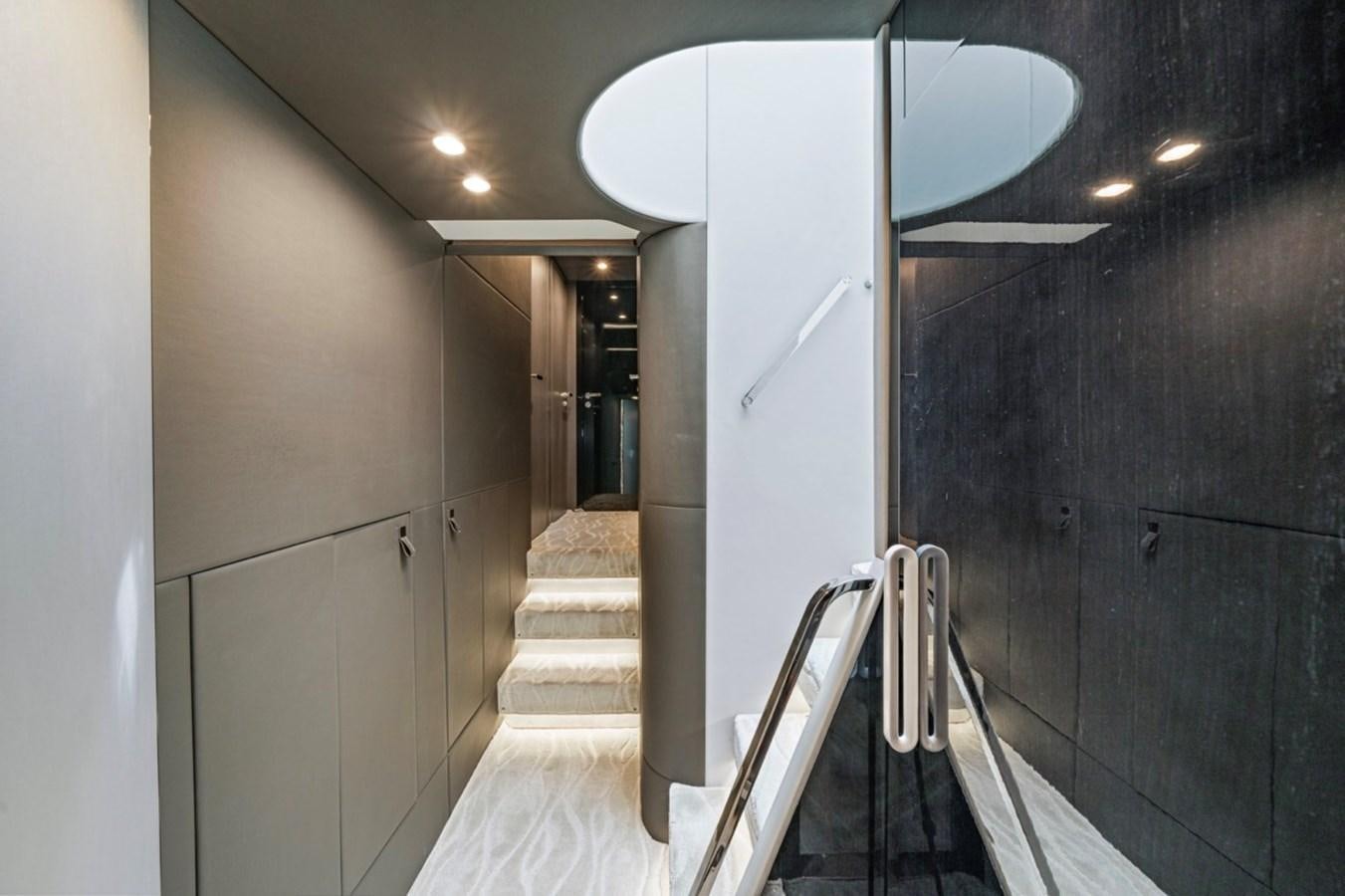 a hallway with a set of stairs aboard JUST KEEP LIVIN Yacht for Sale