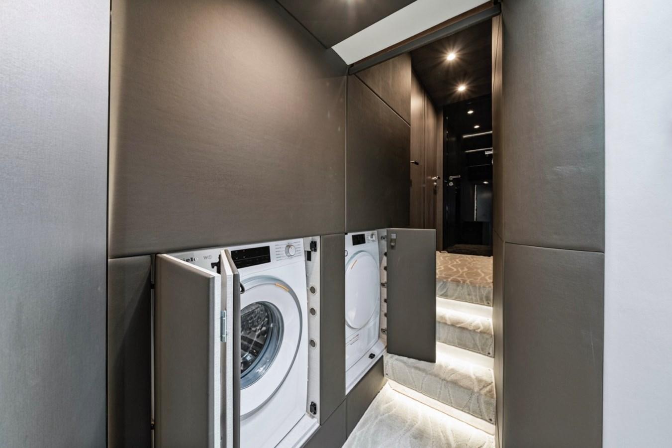 a room with a washing machine and washer aboard JUST KEEP LIVIN Yacht for Sale