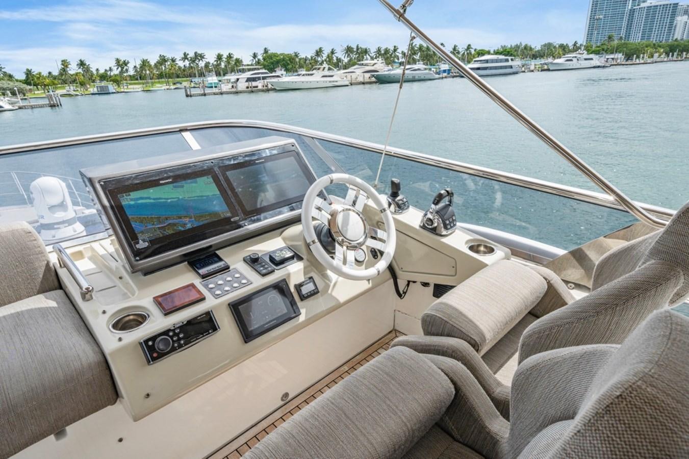 a boat with a screen and a steering wheel on it aboard JUST KEEP LIVIN Yacht for Sale
