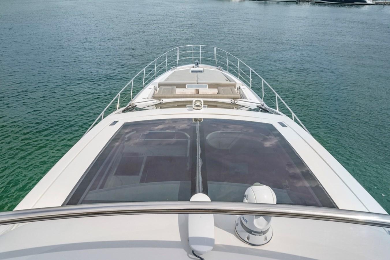 a white boat on the water aboard JUST KEEP LIVIN Yacht for Sale