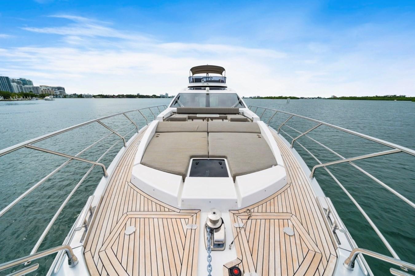 a boat on a body of water aboard JUST KEEP LIVIN Yacht for Sale