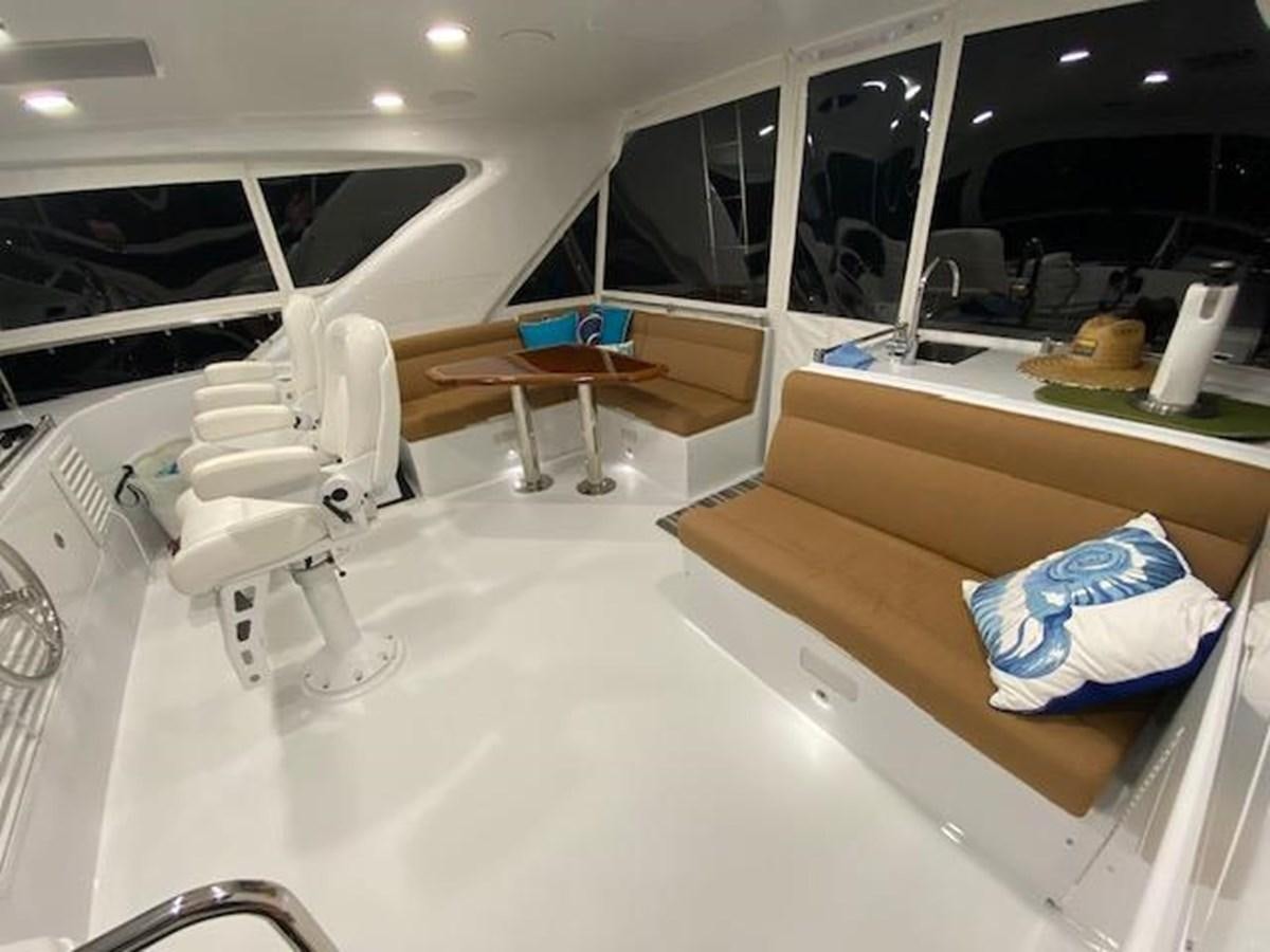 a room with a bed and a desk aboard ISLAND GIRL Yacht for Sale