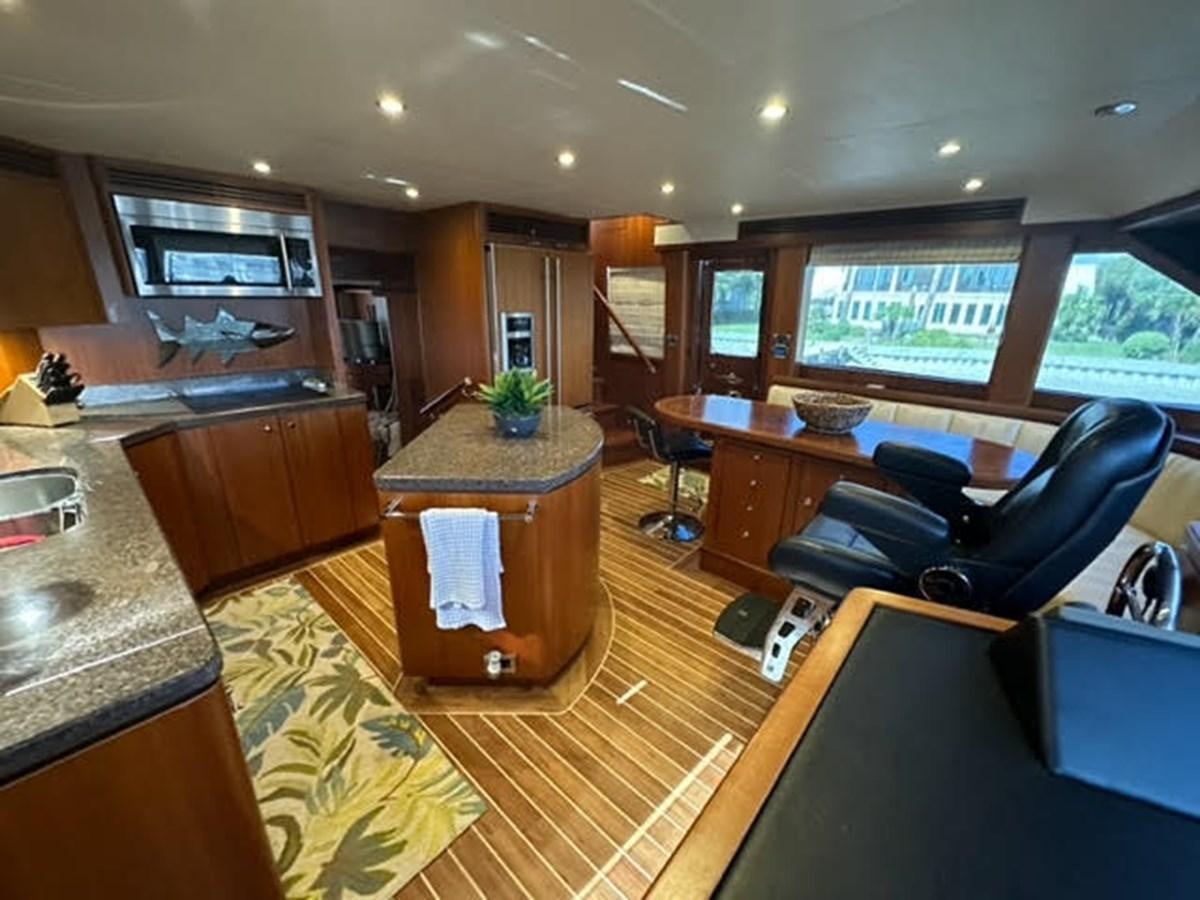 a large room with a couch and a desk aboard ISLAND GIRL Yacht for Sale
