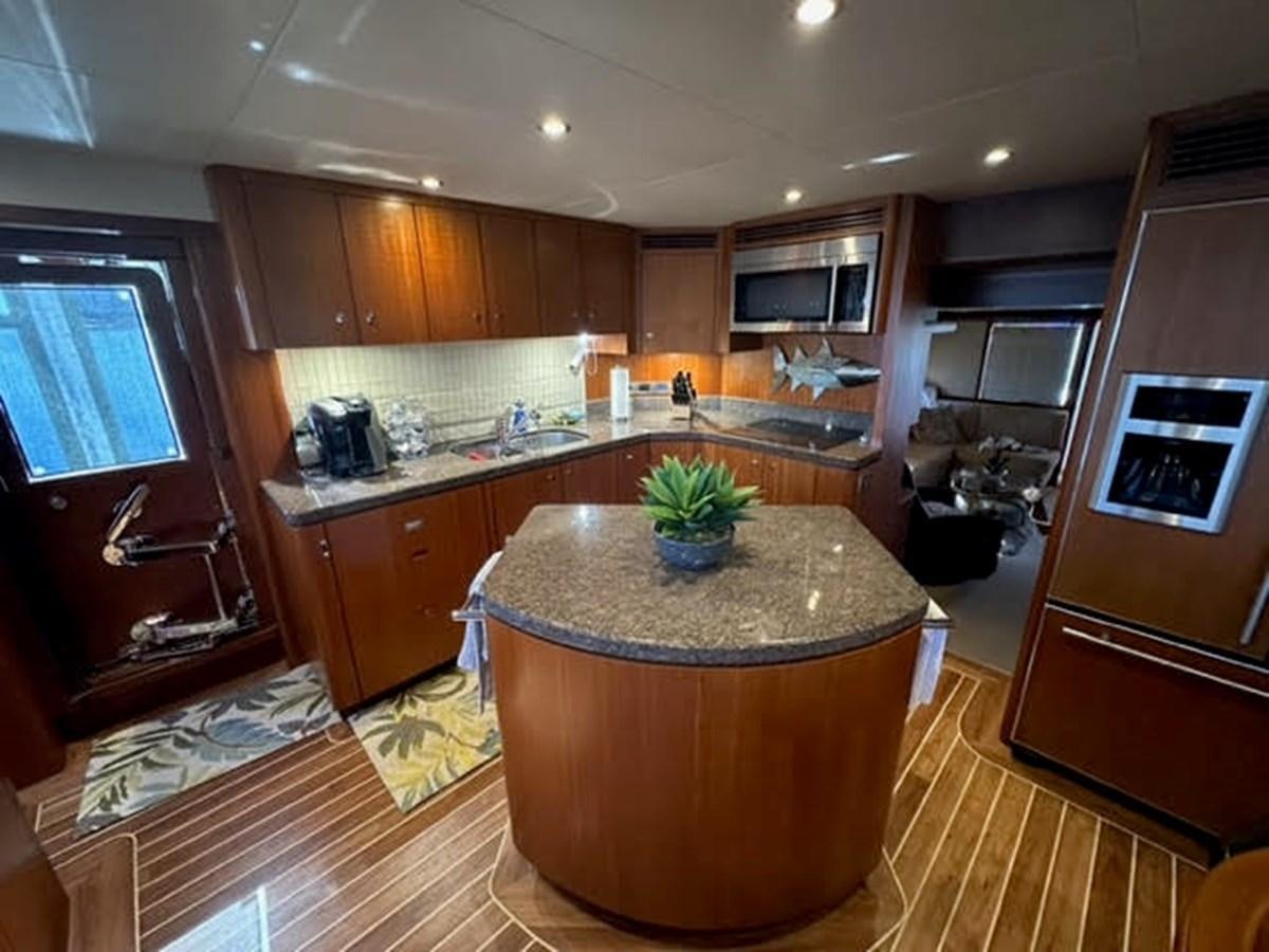 a kitchen with a large island aboard ISLAND GIRL Yacht for Sale